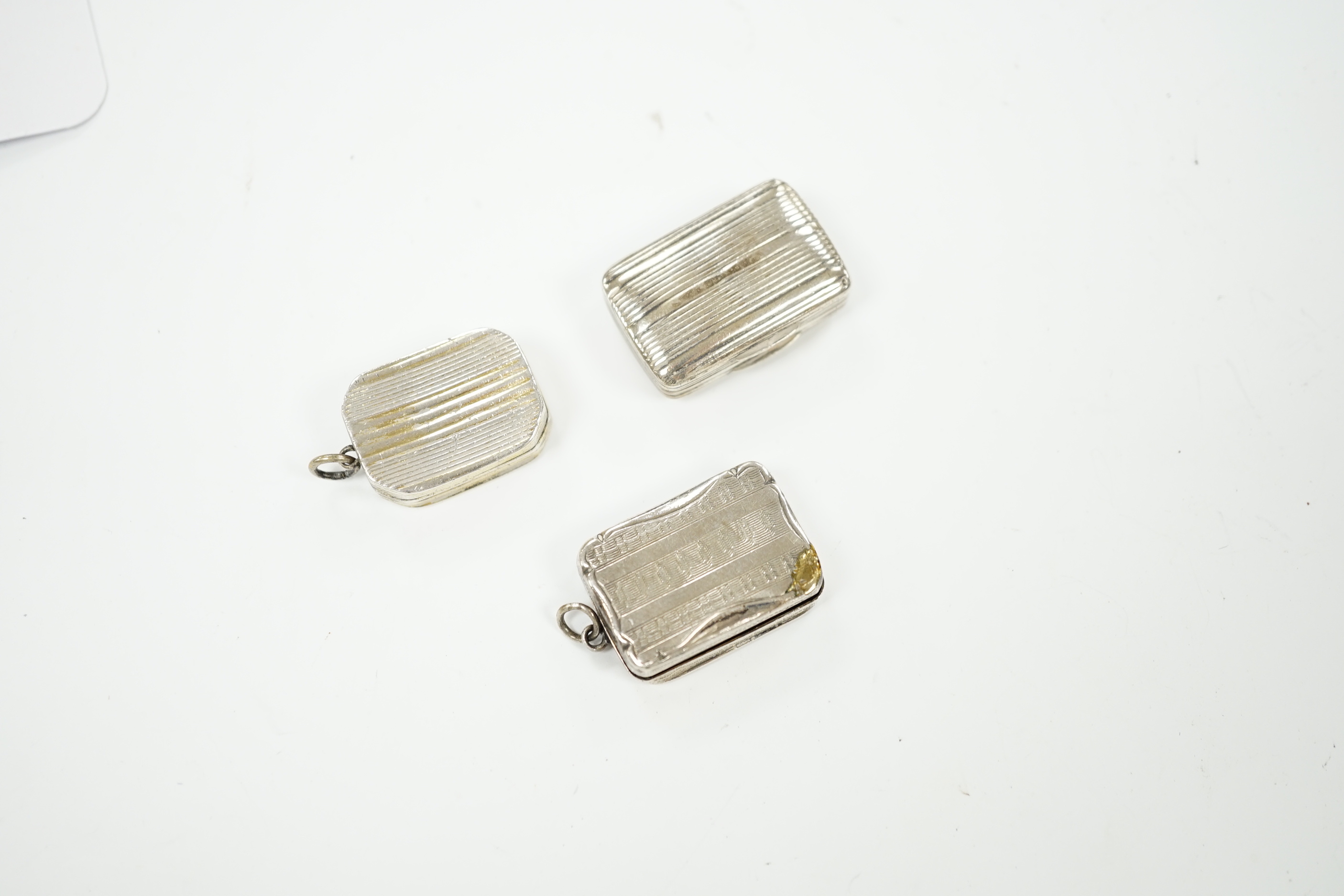 Three assorted 19th century small silver vinaigrettes, including David Pettifer, Birmingham, 1856, 24mm.